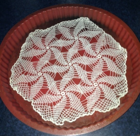 Soak doily in solution and lay on a non stick surface