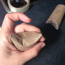 This is how you fold the ends in, but first, cover your roll with coloured paper.